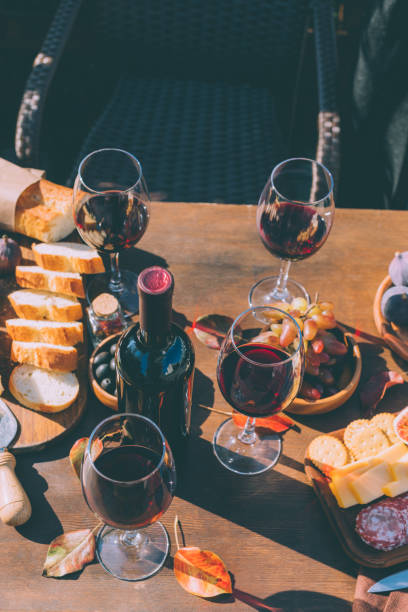 istock red wine and variation of snacks 916216030