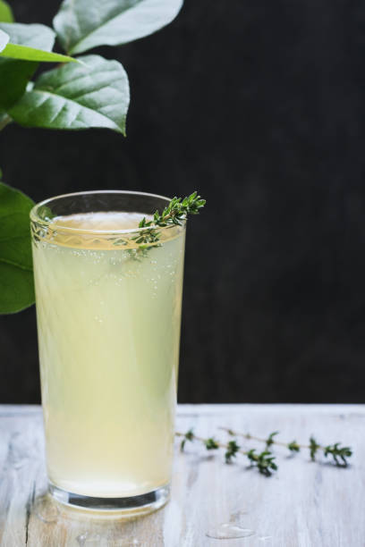 istock Traditional Italian beverage limoncello on a wooden table. 916218664