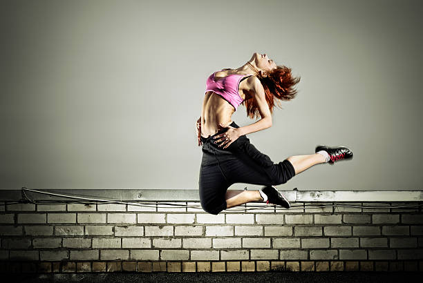istock girl jumping on the roof 91622453