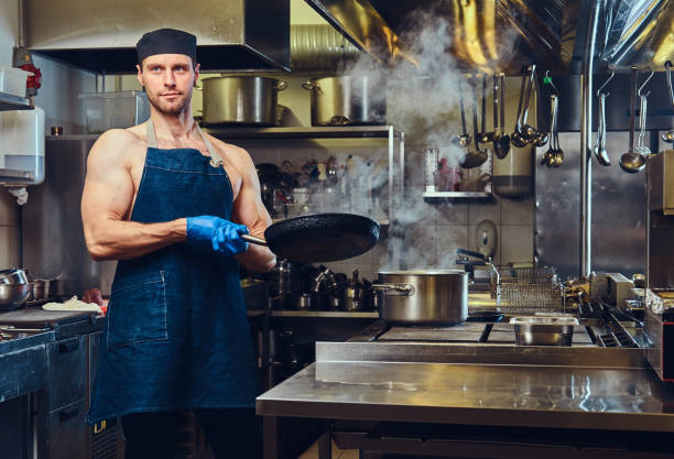 istock The chef holds dry pan. 916231332