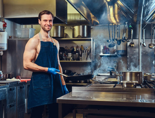 istock The chef holds dry pan. 916231604