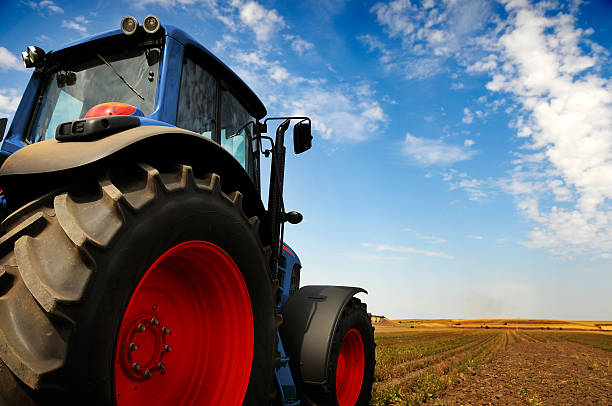 istock The Tractor - modern farm equipment in field 91623263