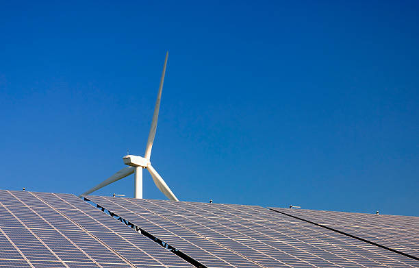 Wind turbines - solar cells power plant stock photo