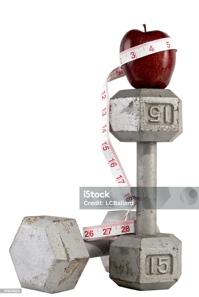 15 kg pesi con una Mela rossa e nastro di misurazione - Foto stock royalty-free di Alimentazione sana