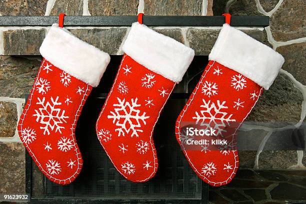 Closeup Of Three Empty Christmas Stockings Hanging In A Row Stock Photo - Download Image Now