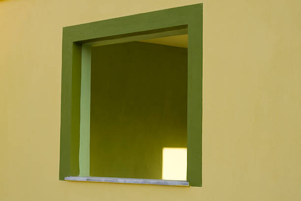 istock yellow wall and green window 91624056