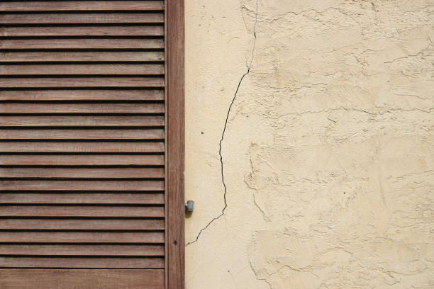 istock Wooden shutters on a old town wall. 916241998