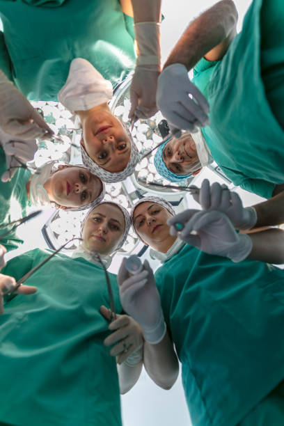 istock Team of nurses and surgeons in surgery 916245554