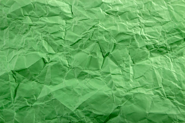 istock Green crepe Wrinkled Paper Texture background abstract 916245812