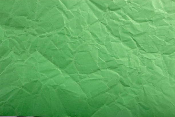istock Green crepe Wrinkled Paper Texture background abstract 916246040
