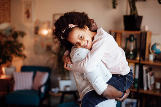 istock Mom hugging her daughter 916246152