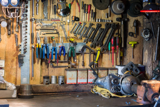 istock Motorcycle parts and tools on the desktop in garage 916248346