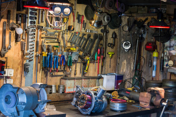 istock Motorcycle parts and tools on the desktop in garage 916248572