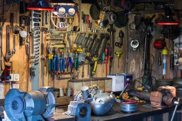 istock Motorcycle parts and tools on the desktop in garage 916248638