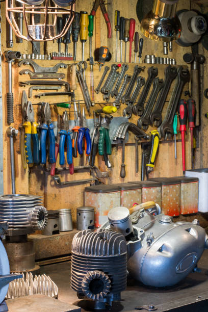 istock Motorcycle parts and tools on the desktop in garage 916249296