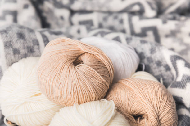istock colored yarn balls and blanket on background 916249640