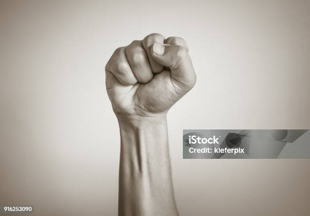 Male Fist In The Air Isolated On White Background Stock Photo - Download Image Now - Punching The Air, Authority, Fist