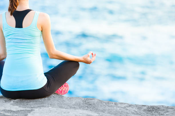 istock Meditation by the sea 916253112