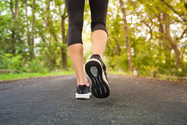 istock Woman walking in beautiful nature setting 916253138