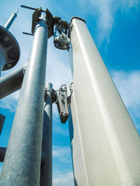 istock Mobile telecommunication tower with antennas view from the top 916255328