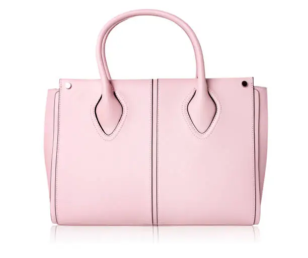 Pink women bag isolated onn white.Leather handbag.