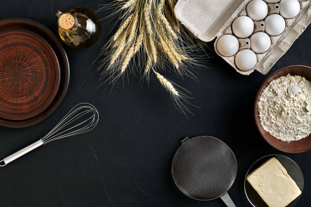 istock Dough preparation recipe bread, pizza or pie making ingredients, food flat lay on kitchen table background. Working with butter, yeast, flour, eggs, oil. Pastry or bakery cooking 916257142
