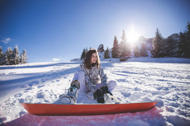 istock Young Snowboarder Girl Sliding Down Hill 916257156