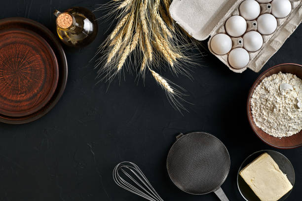 istock Dough preparation recipe bread, pizza or pie making ingredients, food flat lay on kitchen table background. Working with butter, yeast, flour, eggs, oil. Pastry or bakery cooking 916257640