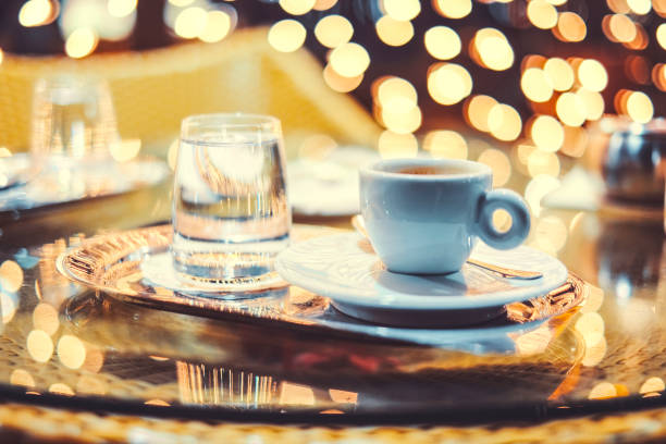istock Coffee cup with out of focus background lights 916263032