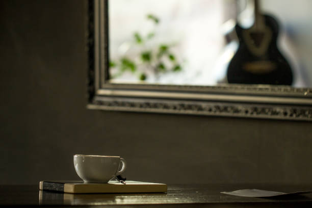 Cup of tea and guitar, interior of a cafe
