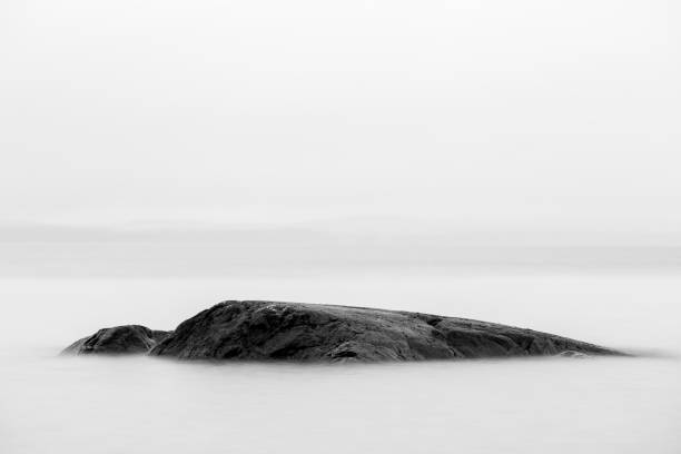 istock Black rock in the sea 916263218