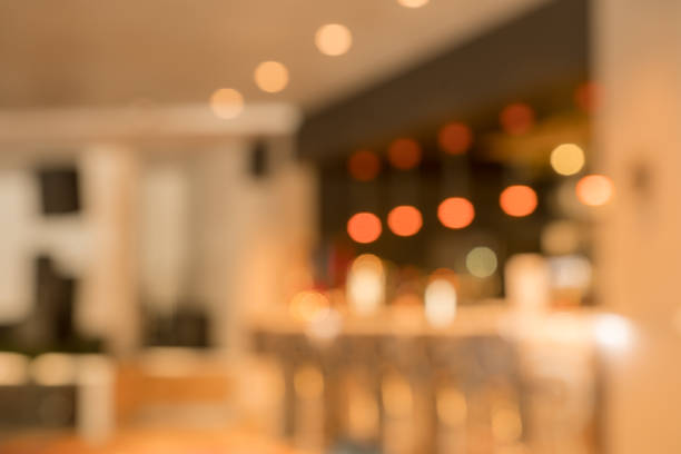 istock Blurry image of a cafe interrior background with bokeh 916266294