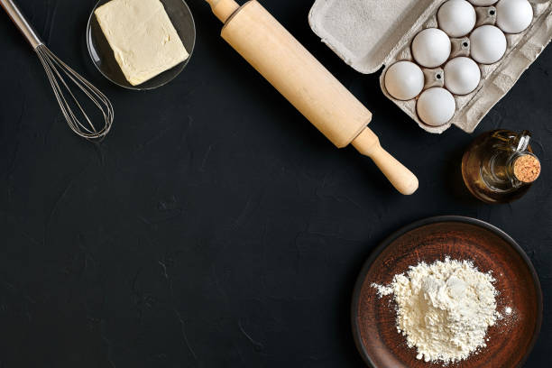 istock Dough preparation recipe bread, pizza or pie making ingredients, food flat lay on kitchen table background. Working with butter, yeast, flour, eggs, oil. Pastry or bakery cooking 916266480