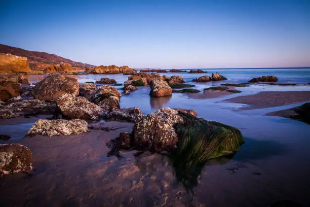 Sunset at the rocky intertidal zone beach at Leo Carrillo State Beach, California.