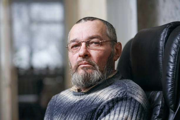 istock A man with a beard in a chair 916274686