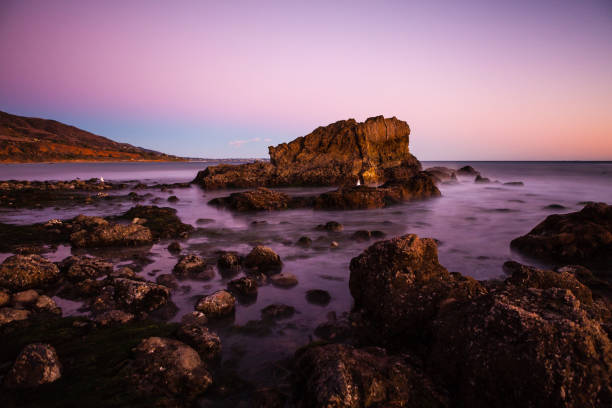 Sunset at the rocky intertidal zone beach at Leo Carrillo State Beach stock photo