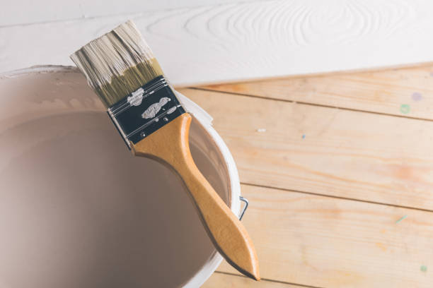 istock brush on plastic bucket with white paint 916275010
