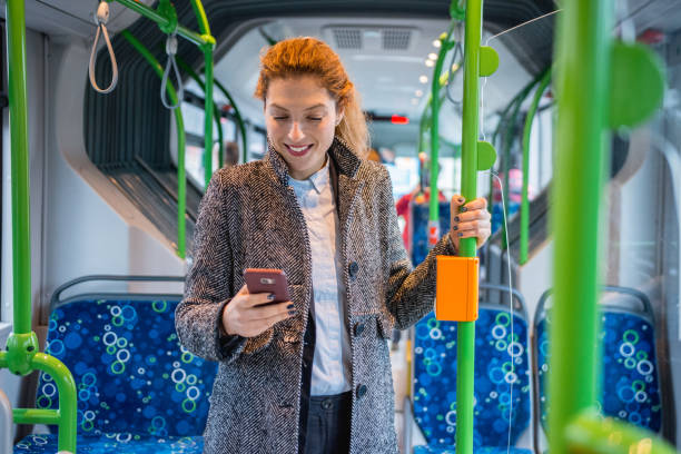 istock Woman driving on the bus and using smart phone 916280650