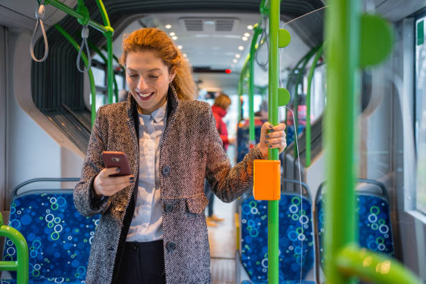 istock Woman driving on the bus and using smart phone 916280682