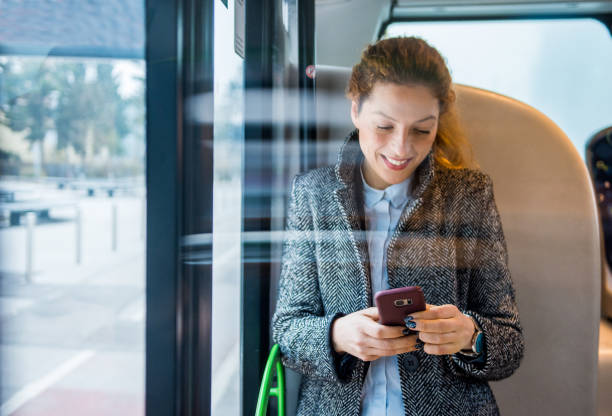 istock Woman using smart phone on the bus 916280688