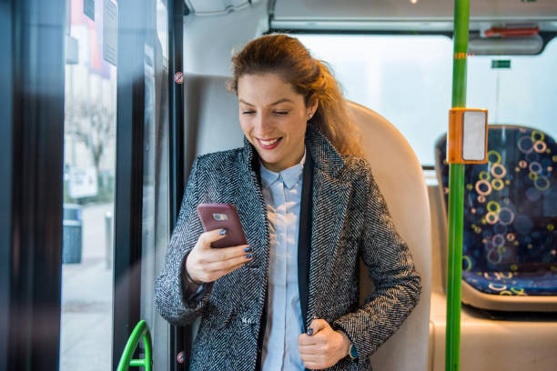 istock Woman using smart phone on the bus 916280698
