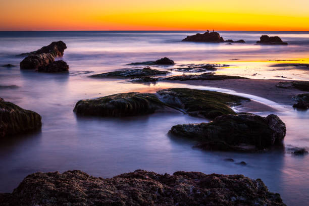 istock Sunset at the rocky intertidal zone beach at Leo Carrillo State Beach 916281278