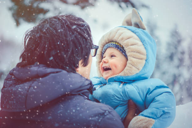 Family enjoying winter in snowy forest