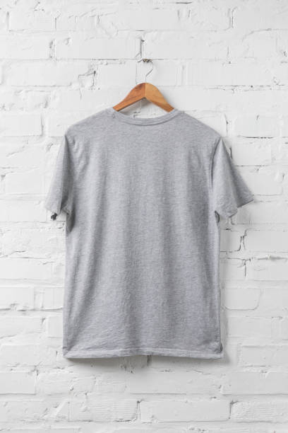 istock one grey shirt on hanger on white wall 916284754