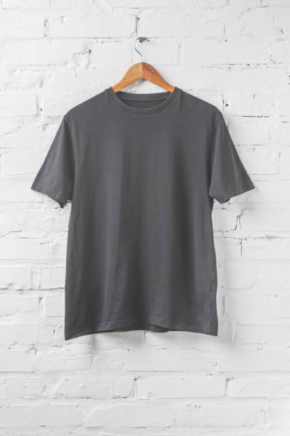 istock one dark grey shirt on hanger on white wall 916284848
