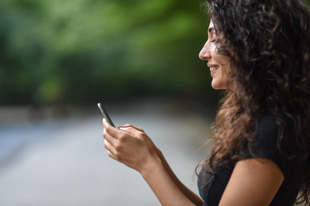 istock Young woman is using mobile phone 916284950