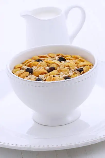 Delicious and nutritious lightly toasted breakfast muesli or granola cereal on vintage styling.