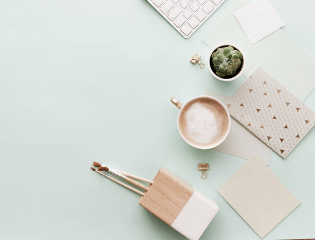 istock Minimalist Flat Lay Hipster Desktop With Coffee Latte and Supplies 916288610