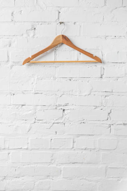 black clothes hanger  on a metal clothes rack inside bedroom or hotel door