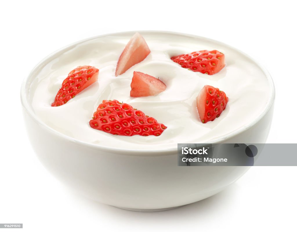 bowl of yogurt cream with fresh strawberries bowl of yogurt cream with fresh strawberries isolated on white background Yogurt Stock Photo